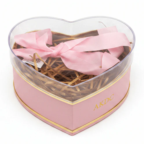 AKDC Cute Pink Heart-Shaped Cardboard Gift Box with Clear Plastic Lid & Ribbon Ties for Chocolates, Jewelry & Valentine Gifts – 11×11 cm