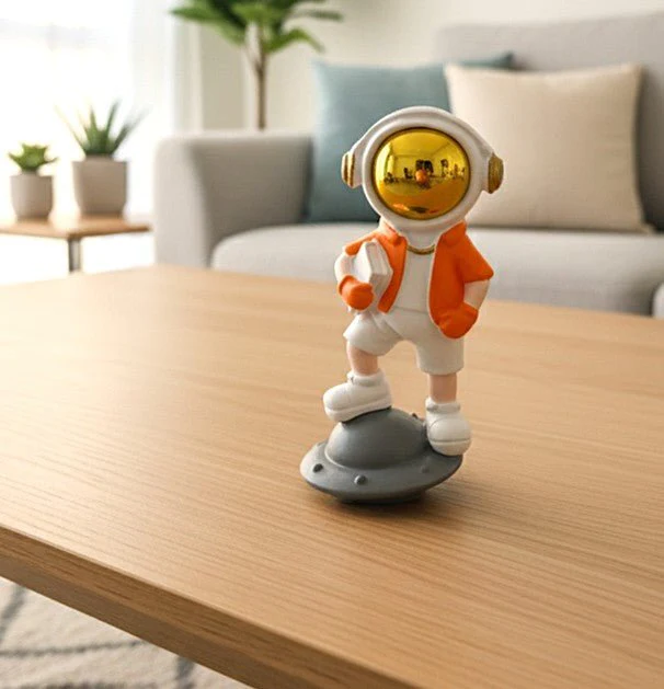 AKDC Stylish Ceramic Astronaut Standing on White & Orange Spaceship Figurine – Contemporary Space Décor 14 cm - Image 2